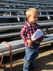 2 year old cowboy salutes the flag