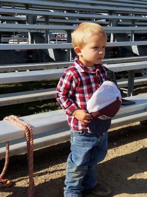 2 year old cowboy salutes the flag